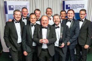Andrew Savage, Executive Development Director, holding the Constructing Excellence Norfolk 2023 award, with members of the project team