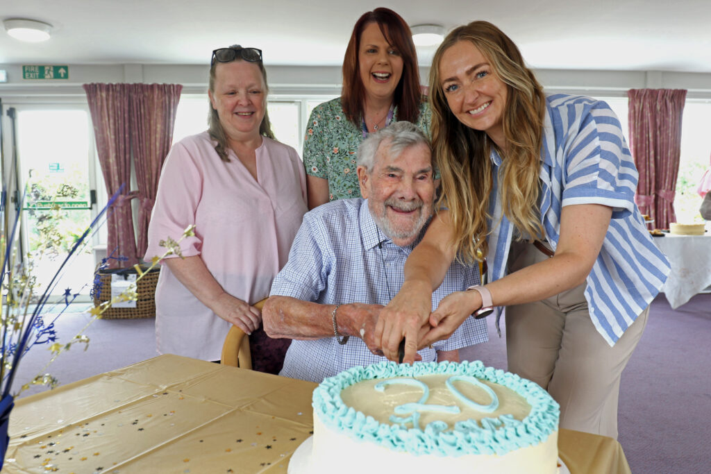 people cutting cake